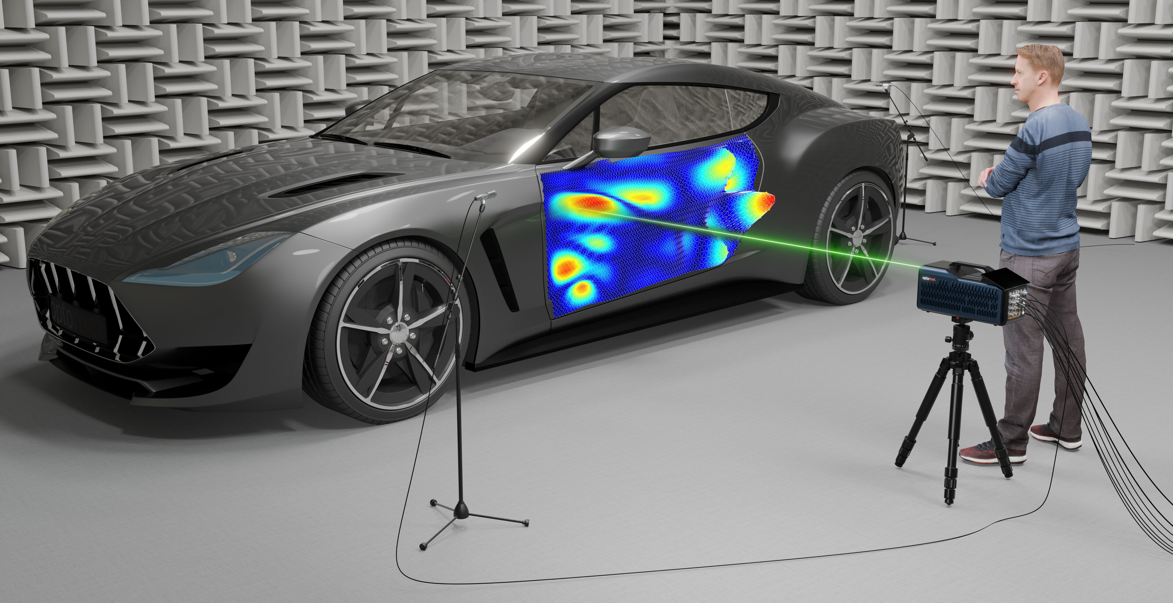 An engineer performs a vibration analysis on a car in an anechoic room. A laser Doppler vibrometer points a laser beam at the car door to capture precise vibration data displayed as a color-coded map on the door. The room is specially designed for acoustic testing.